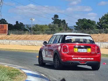 Fifth Gear mini cooper being driven at a defensive driving course.